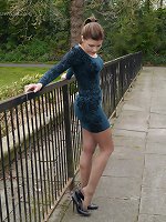 Hot babe Naomi is outdoors in a short tight dress showing off her sexy long nylon encased legs with some high pointed stiletto heels
